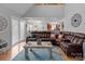 Inviting living room featuring a comfortable leather sectional and stylish decor at 230 Castle Keep Rd, Salisbury, NC 28146