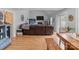 Open-concept living room with hardwood flooring, stone fireplace, and neutral wall paint at 230 Castle Keep Rd, Salisbury, NC 28146