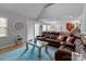 Spacious living room with natural light, hardwood flooring, and access to the backyard at 230 Castle Keep Rd, Salisbury, NC 28146