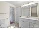 Bathroom featuring a modern sink with vanity, a large mirror, and decorative lighting at 300 N Ervin Ave, Newton, NC 28658