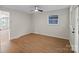 Bedroom featuring natural light, wood-look floors, and an adjacent bathroom at 300 N Ervin Ave, Newton, NC 28658