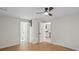 Large bedroom features a ceiling fan, an en-suite bathroom and a glimpse of the kitchen at 300 N Ervin Ave, Newton, NC 28658