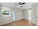 Bedroom includes a ceiling fan, a glass exterior door and an en-suite bathroom at 300 N Ervin Ave, Newton, NC 28658