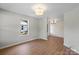 Bright bedroom with hardwood floors, natural light, and neutral tones at 300 N Ervin Ave, Newton, NC 28658