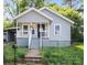 Charming single-story home with a cozy front porch and well-maintained lawn, offering a welcoming curb appeal at 300 N Ervin Ave, Newton, NC 28658