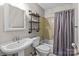 Bathroom with a neutral color scheme featuring a vanity sink, toilet, and bathtub with shower at 1300 Larchmont Pl # 306, Salisbury, NC 28144