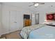 Bedroom with a ceiling fan, dresser with a TV, and a comfortable bed with floral pattern bedding at 1300 Larchmont Pl # 306, Salisbury, NC 28144
