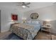 Bedroom with a ceiling fan and a comfortable bed with floral pattern bedding at 1300 Larchmont Pl # 306, Salisbury, NC 28144