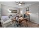 Comfortable home office with a cozy chair, wooden desk, and charming decor for a productive workspace at 1300 Larchmont Pl # 306, Salisbury, NC 28144