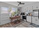 Bright kitchen featuring white cabinetry, a vintage table, and natural light creating a functional and inviting cooking space at 1300 Larchmont Pl # 306, Salisbury, NC 28144