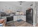 Practical kitchen featuring white cabinets, updated appliances, and ample counter space for efficient meal preparation at 1300 Larchmont Pl # 306, Salisbury, NC 28144