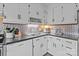 Functional kitchen featuring ample counter space, updated appliances, and efficient storage solutions for a seamless cooking experience at 1300 Larchmont Pl # 306, Salisbury, NC 28144
