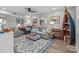 Bright living room features stylish decor, a ceiling fan, and comfortable seating at 1300 Larchmont Pl # 306, Salisbury, NC 28144