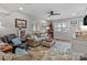Bright living room features stylish decor, a ceiling fan, and comfortable seating at 1300 Larchmont Pl # 306, Salisbury, NC 28144