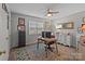 Functional home office with a ceiling fan, desk, natural light, and ample storage creating a productive workspace at 1300 Larchmont Pl # 306, Salisbury, NC 28144