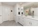Bathroom with double sink vanity, quartz countertops, and framed mirror at 330 Hyssop Ct, Fort Mill, SC 29715