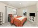 This bright bedroom offers neutral walls, plush carpet, and large windows allowing natural light to illuminate the space at 330 Hyssop Ct, Fort Mill, SC 29715