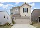 Charming two-story home with a stone and siding exterior, showcasing its inviting curb appeal and well-maintained facade at 330 Hyssop Ct, Fort Mill, SC 29715