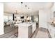 Bright kitchen features granite counters, stainless appliances, and opens to dining and living areas at 330 Hyssop Ct, Fort Mill, SC 29715