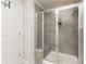 Bathroom shower with sliding glass door, gray tile and a built-in niche at 330 Hyssop Ct, Fort Mill, SC 29715