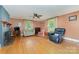 Bright living room featuring hardwood floors and a charming fireplace at 3332 Celanese Rd, Rock Hill, SC 29732