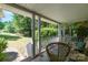 Inviting covered front porch with wicker furniture and a peaceful view of the expansive landscaped front yard at 3332 Celanese Rd, Rock Hill, SC 29732