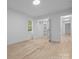 A bright bedroom with hardwood floors and ample closet space at 3417 Chilham Pl, Charlotte, NC 28226