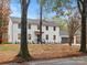 Beautiful two-story farmhouse style home featuring professionally landscaped yard at 3417 Chilham Pl, Charlotte, NC 28226