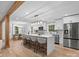 Open kitchen with a large island, modern appliances, and seamless flow to the dining area at 3417 Chilham Pl, Charlotte, NC 28226