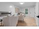 Bright living room with a modern fireplace, neutral paint, and hardwood floors at 3417 Chilham Pl, Charlotte, NC 28226