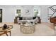 Comfortable living room with stylish decor, natural light, and an eye-catching gold accent table at 3417 Chilham Pl, Charlotte, NC 28226