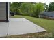 Expansive concrete patio in the backyard, ideal for outdoor seating and enjoying the serene landscape at 379 Maiden Sw Ln, Concord, NC 28025