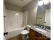 Bathroom featuring a tub and shower combination and vanity with granite countertop at 379 Maiden Sw Ln, Concord, NC 28025
