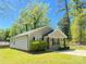 Cozy single-story house showcases a well-maintained lawn and traditional architecture with a covered front entry at 379 Maiden Sw Ln, Concord, NC 28025