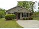 Charming home exterior featuring a well-maintained lawn and a welcoming front entrance at 379 Maiden Sw Ln, Concord, NC 28025
