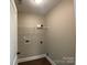 Laundry room with wood-look flooring, and shelving at 379 Maiden Sw Ln, Concord, NC 28025