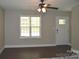 Inviting living room features neutral walls, hardwood floors, and a window with natural light, creating a serene atmosphere at 379 Maiden Sw Ln, Concord, NC 28025
