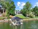 Beautiful backyard featuring a boat dock with covered storage and manicured lawn at 4039 5Th Nw St, Hickory, NC 28601