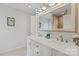 Bright bathroom featuring a double sink vanity with quartz countertops and modern fixtures at 4039 5Th Nw St, Hickory, NC 28601