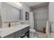 Bathroom featuring a vanity with sink and cabinet space and a separate walk-in shower with stone flooring at 4039 5Th Nw St, Hickory, NC 28601