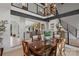 Stunning dining room with a large table, elegant chandelier, and open view to the living area and upper level at 4039 5Th Nw St, Hickory, NC 28601