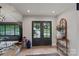 Inviting entryway featuring double doors, hardwood floors, and stylish decor at 4039 5Th Nw St, Hickory, NC 28601