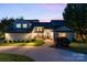 Well-lit home exterior with a manicured lawn and inviting entrance at dusk at 4039 5Th Nw St, Hickory, NC 28601