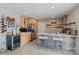 Basement kitchen bar featuring modern bar stools, a wine cooler, and natural wood cabinets at 4039 5Th Nw St, Hickory, NC 28601