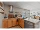 Kitchen featuring a modern sink and stainless-steel dishwasher, plus light wood colored cabinets at 4039 5Th Nw St, Hickory, NC 28601