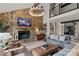Cozy living room with a stone fireplace, built-in bookshelves, and comfortable seating arrangement at 4039 5Th Nw St, Hickory, NC 28601