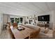 Spacious living room features a decorative fireplace, comfortable seating, and sliding glass doors to the pool at 4039 5Th Nw St, Hickory, NC 28601