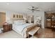 A spacious main bedroom features a large, tufted bed, wood floors and neutral walls at 4039 5Th Nw St, Hickory, NC 28601