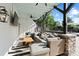 Inviting outdoor living space featuring a comfortable wicker sectional and ceiling fan, ideal for relaxation at 4039 5Th Nw St, Hickory, NC 28601