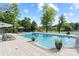 Inviting swimming pool with surrounding patio, lounge chairs, and lake views at 4039 5Th Nw St, Hickory, NC 28601